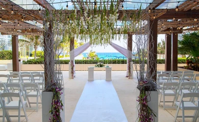 Ceremony setup at The Vine Terrace wedding venue at Secrets The Vine Cancun.