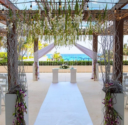 Ceremony setup at The Vine Terrace wedding venue at Secrets The Vine Cancun.