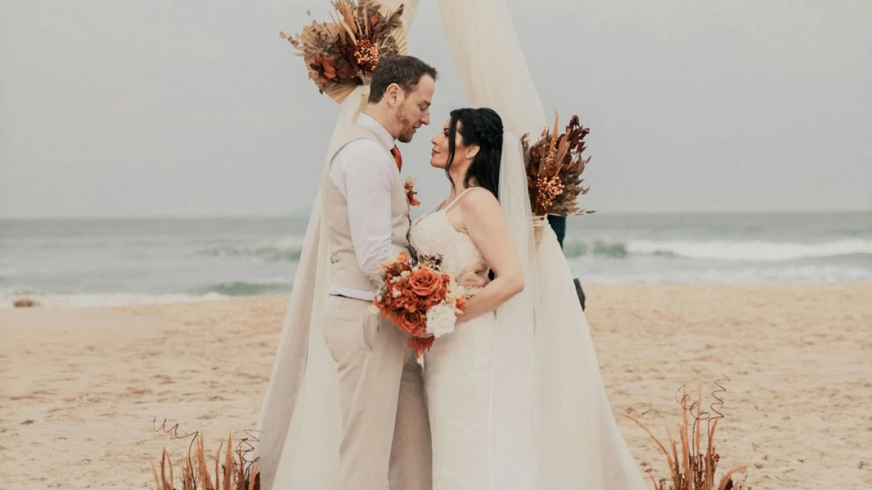 groom and bride on the beach