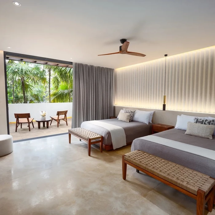 bedroom with double beds at Secrets Tulum