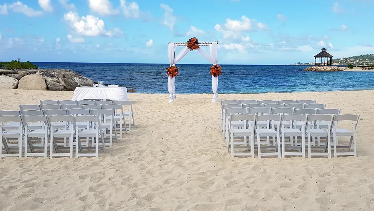 Ceremony setup on the Barracuda beach venue at Secrets Wild Orchid.