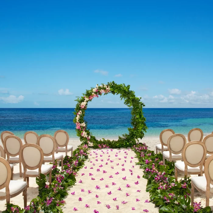 Ceremony setup on the Barracuda beach venue at Secrets Wild Orchid.