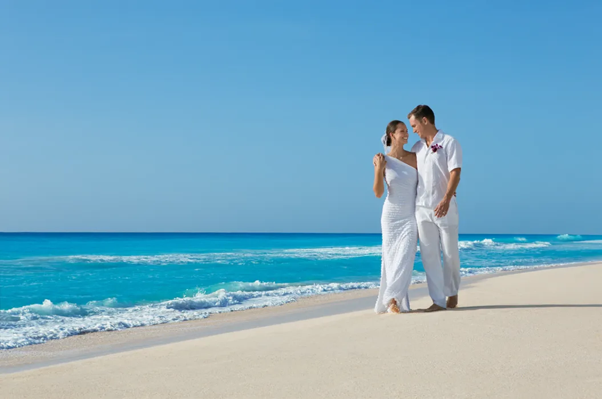 Ceremony setup on the Barracuda beach venue at Secrets Wild Orchid.