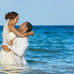 Couple on the beach at Secrets Wild Orchid