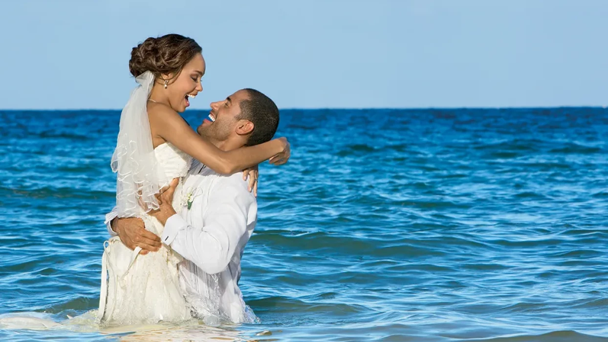 Couple on the beach at Secrets Wild Orchid