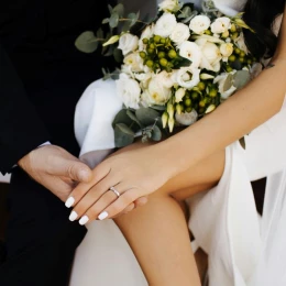 groom and bride holding hands