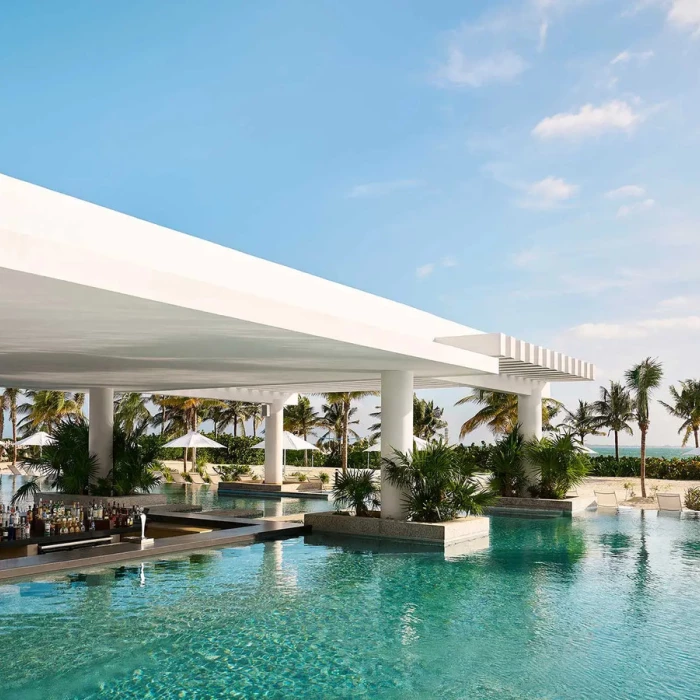 pool with swim-up bar at SLS Playa Mujeres