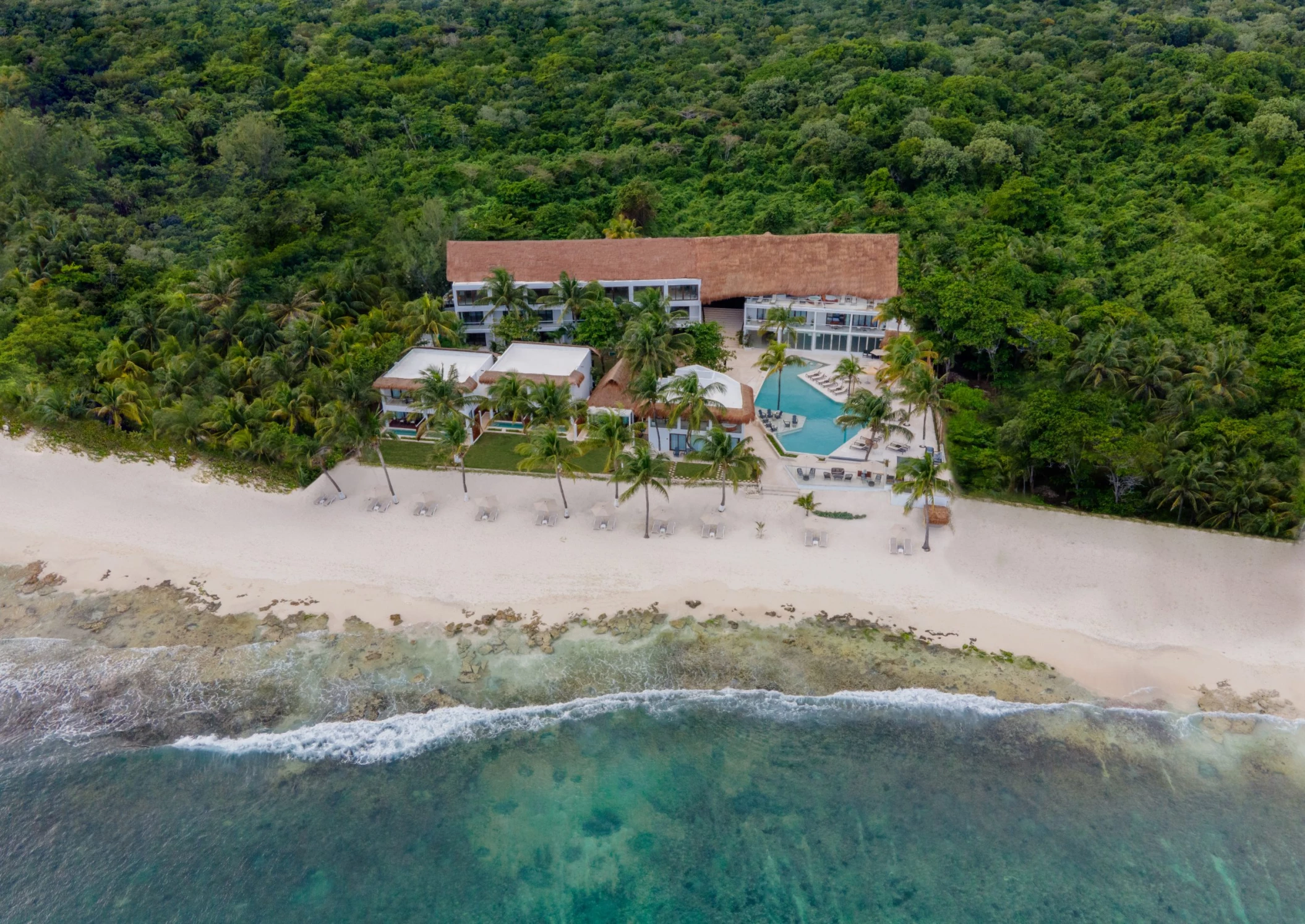aerial view of The Beachfront by The Fives with its pools and accommodations and beach