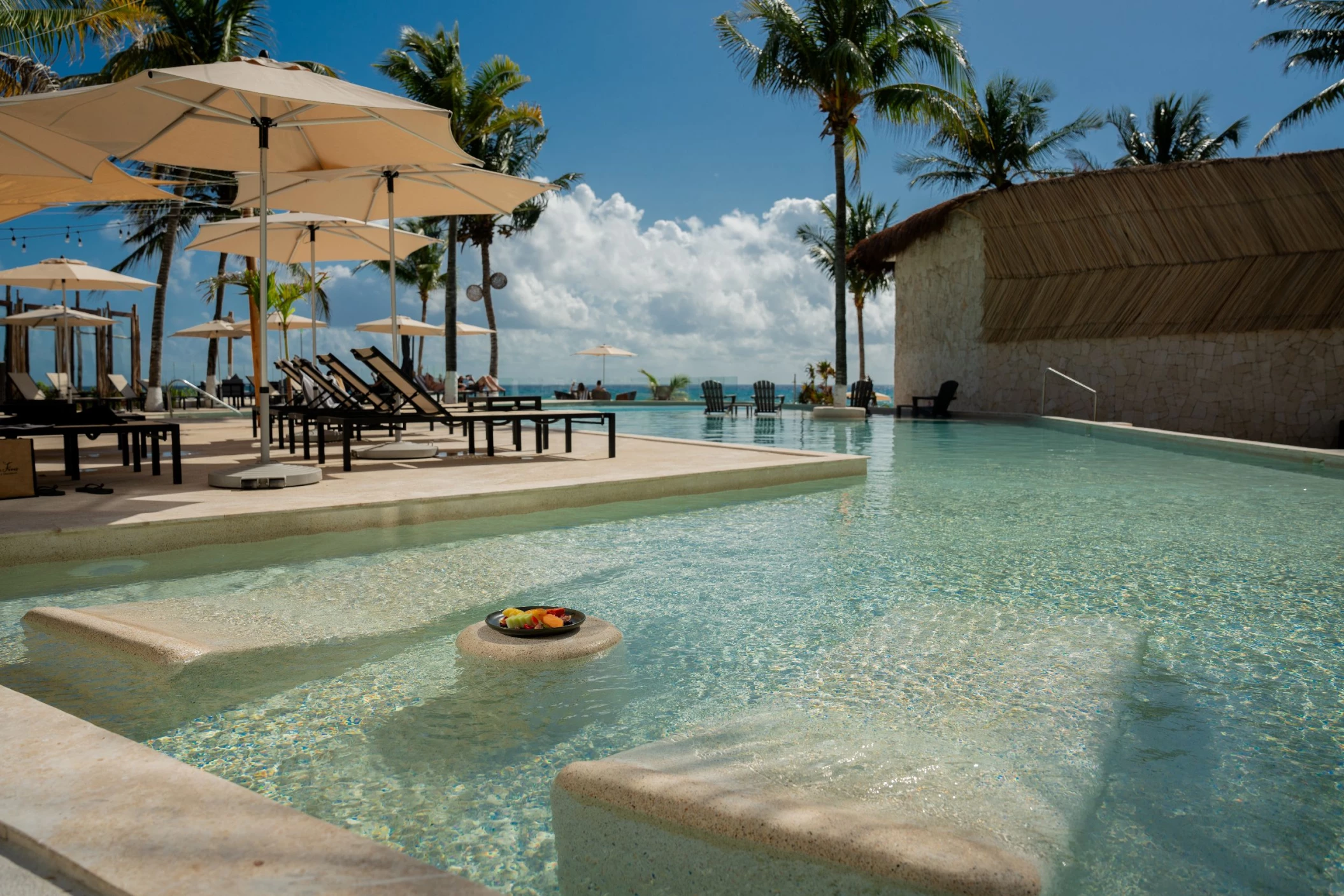 pool and loungers at The Beachfront by The Fives