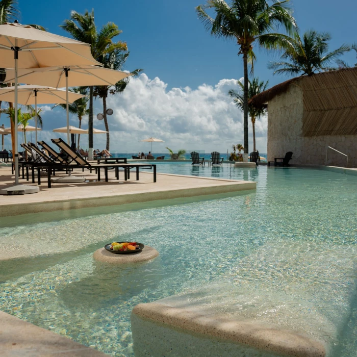 pool and loungers at The Beachfront by The Fives