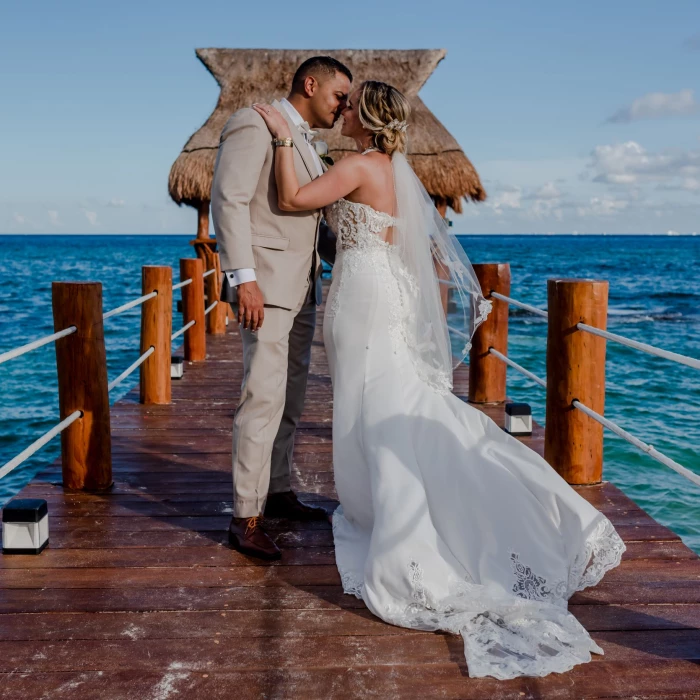 bride and groom at the pier at The Fives Beach Hotel & Residences