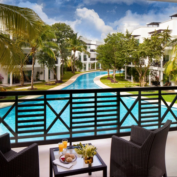 view of the pool from the balcony of a suite at The Fives Beach Hotel & Residences