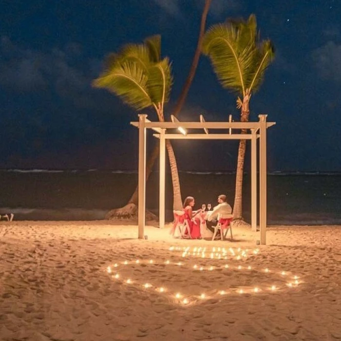 couple having romantic dinner on the beach at TRS Turquesa