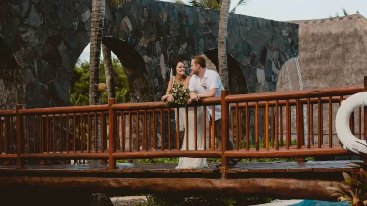 Couple on the bridge ay Valentin Imperial Maya Resort.