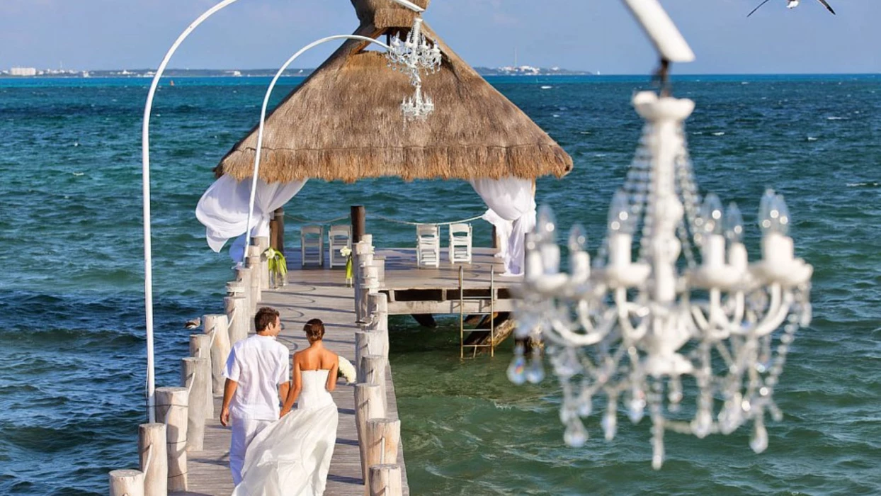 bride and groom at the pier venue at Villa del Palmar Cancun