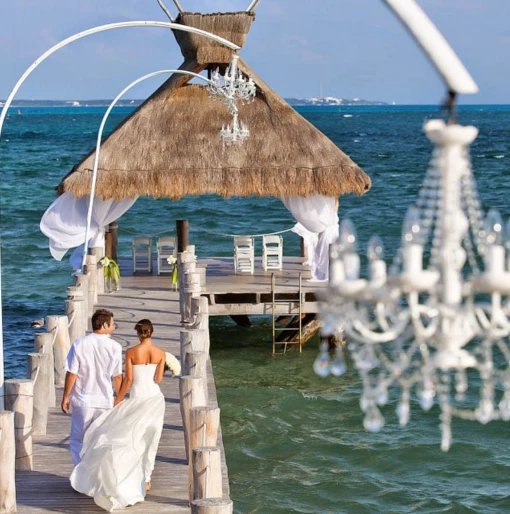 bride and groom at the pier venue at Villa del Palmar Cancun