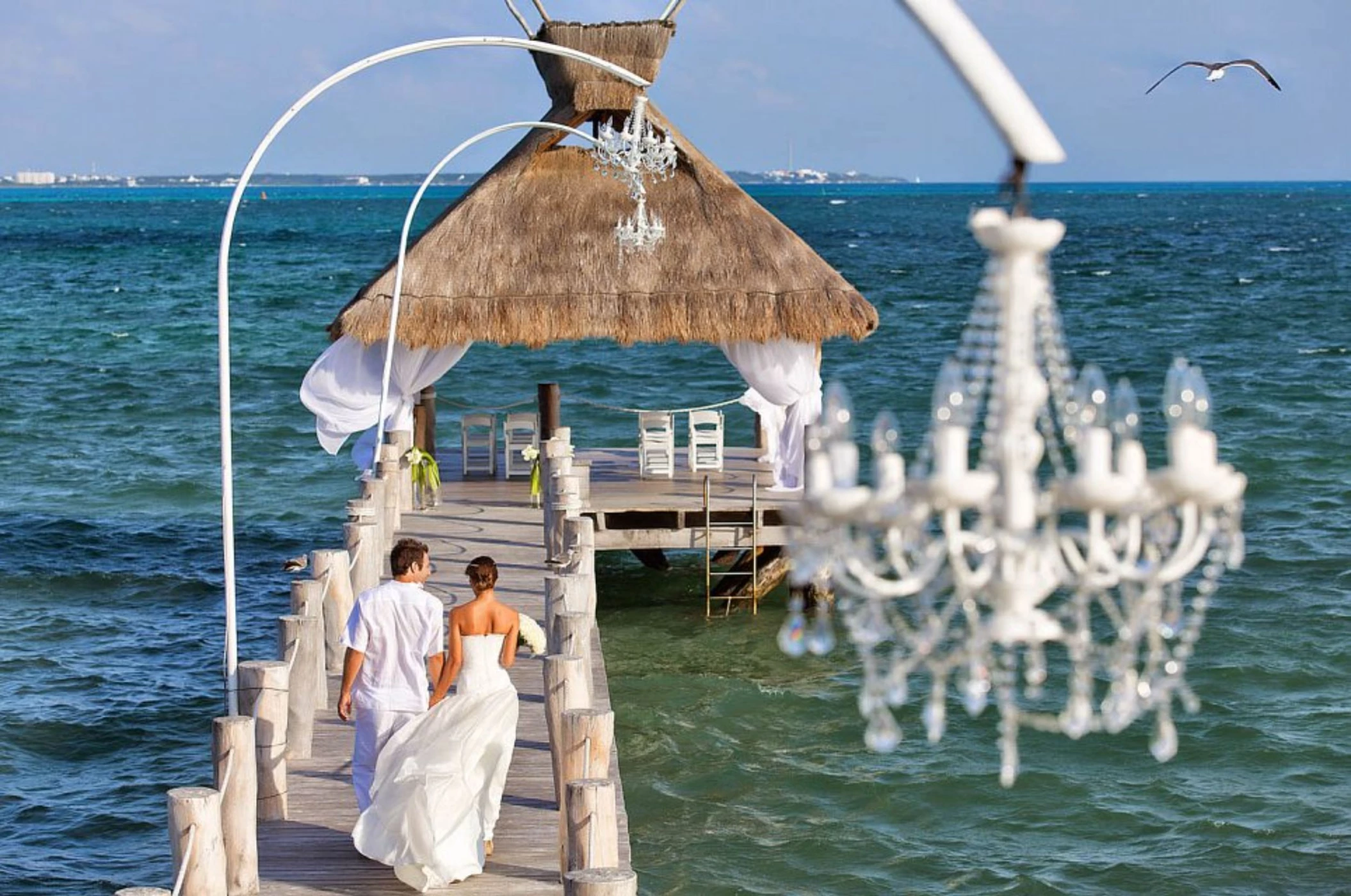 bride and groom at the pier venue at Villa del Palmar Cancun