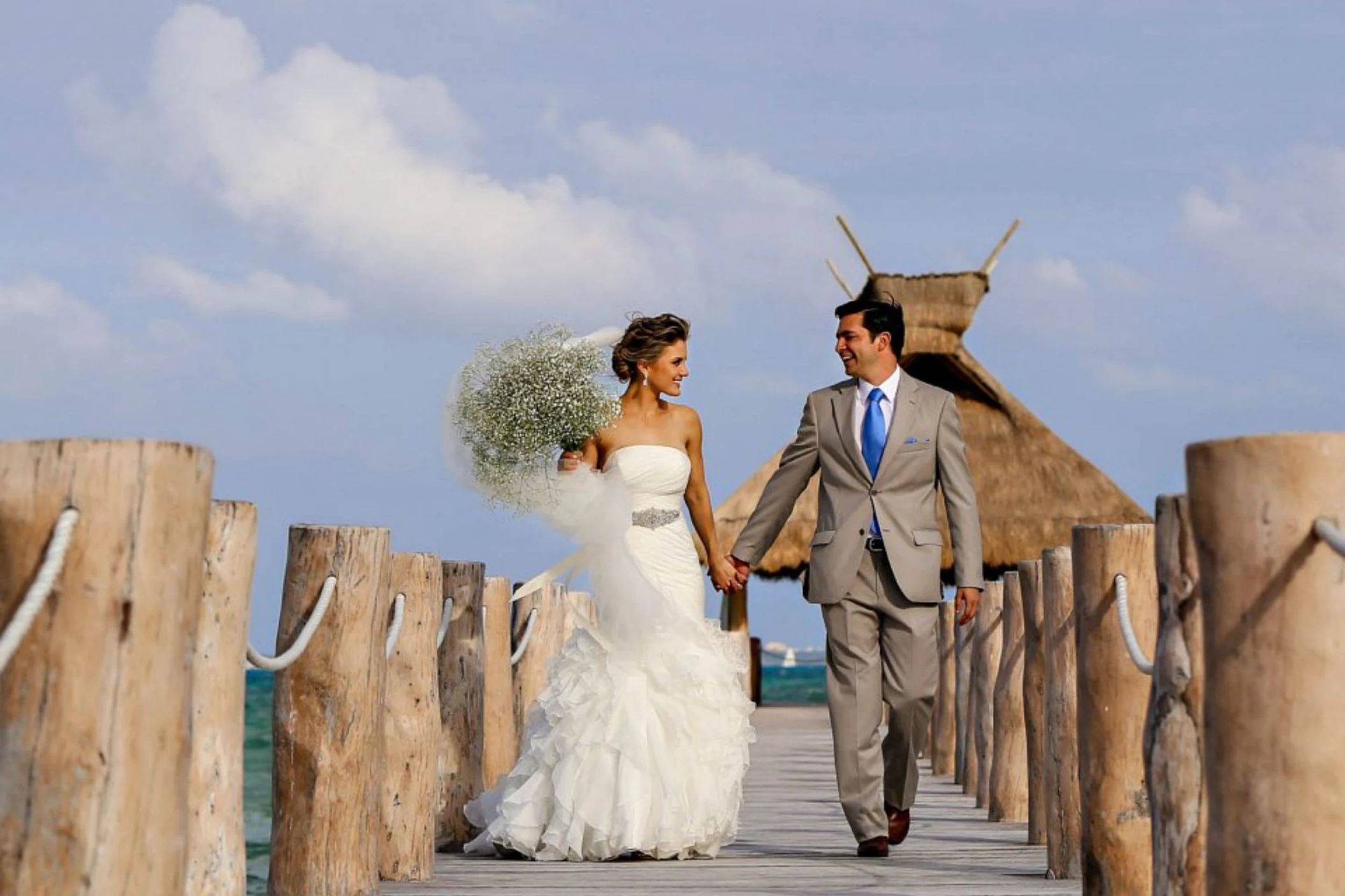 bride and groom at the pier venue at Villa del Palmar Cancun