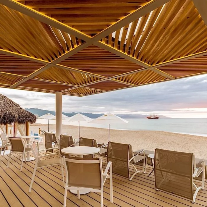 loungers on the beach at Villa Premiere Boutique Hotel