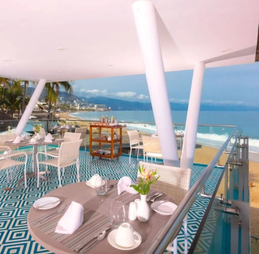 rooftop restaurant with ocean views at Villa Premiere Boutique Hotel