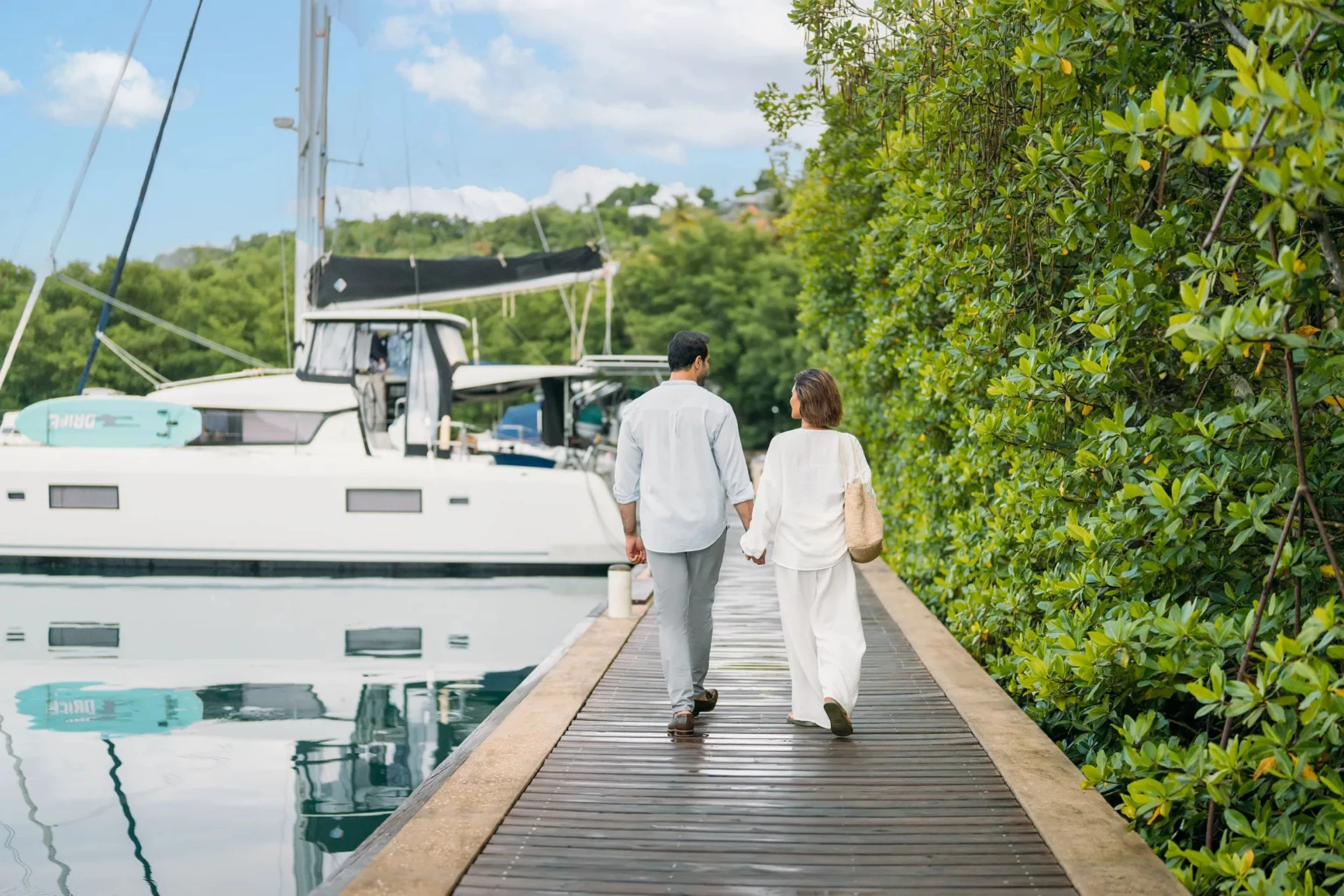 couple walking down the marina at Zoetry Marigot Bay St. Lucia