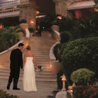 Royal Hideaway Playacar adults-only stairs with bride and groom