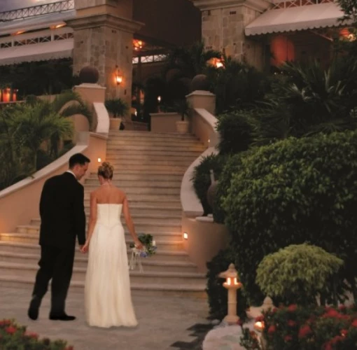 Royal Hideaway Playacar adults-only stairs with bride and groom