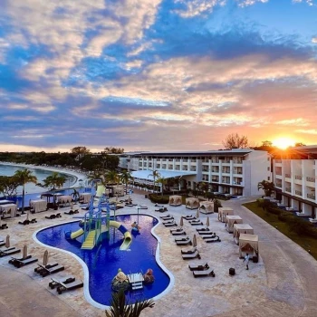 Royalton Negril Pools Overview at sunset.