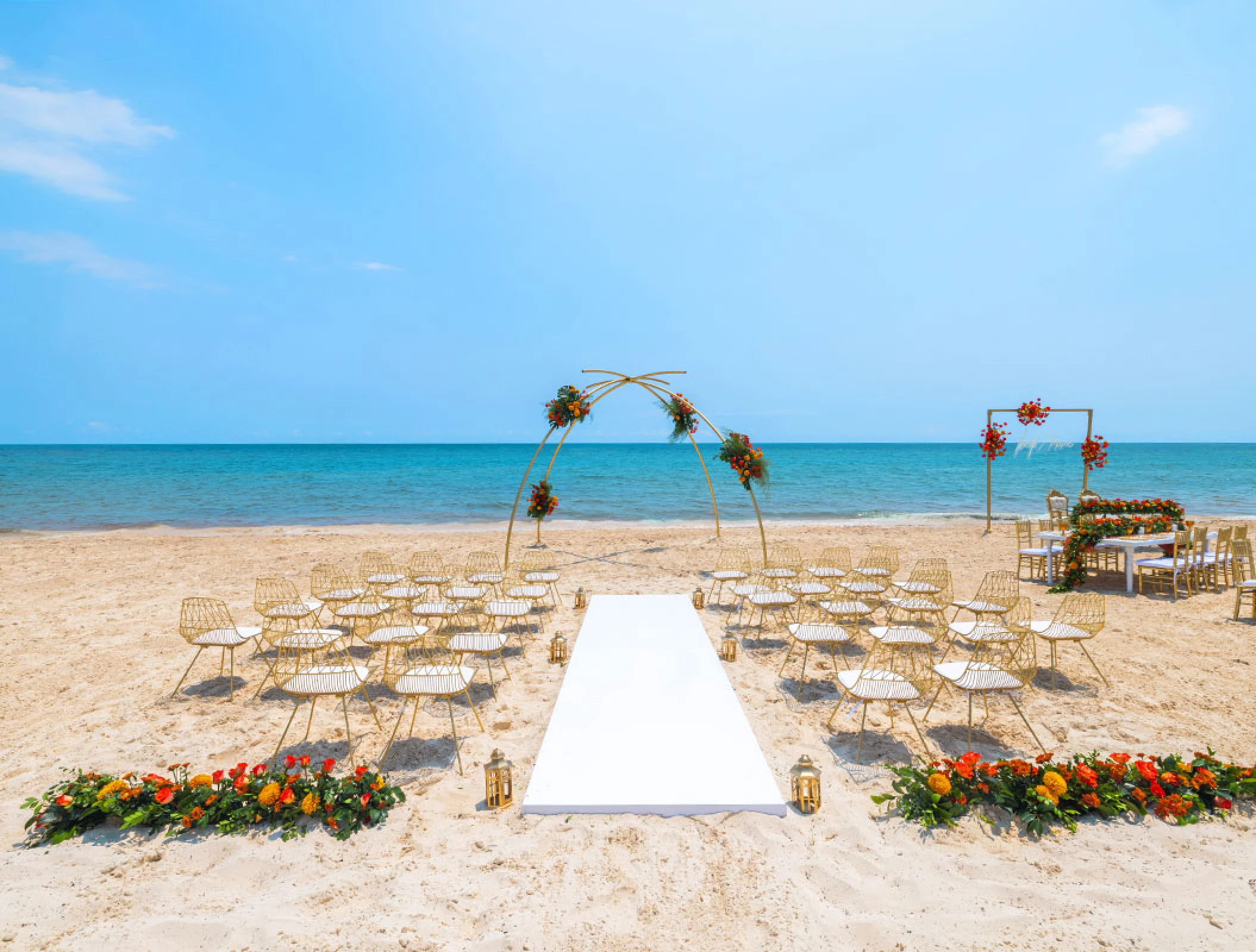 Wedding Ceremony and reception setup at beach venue on Royalton Splash Riviera Cancun