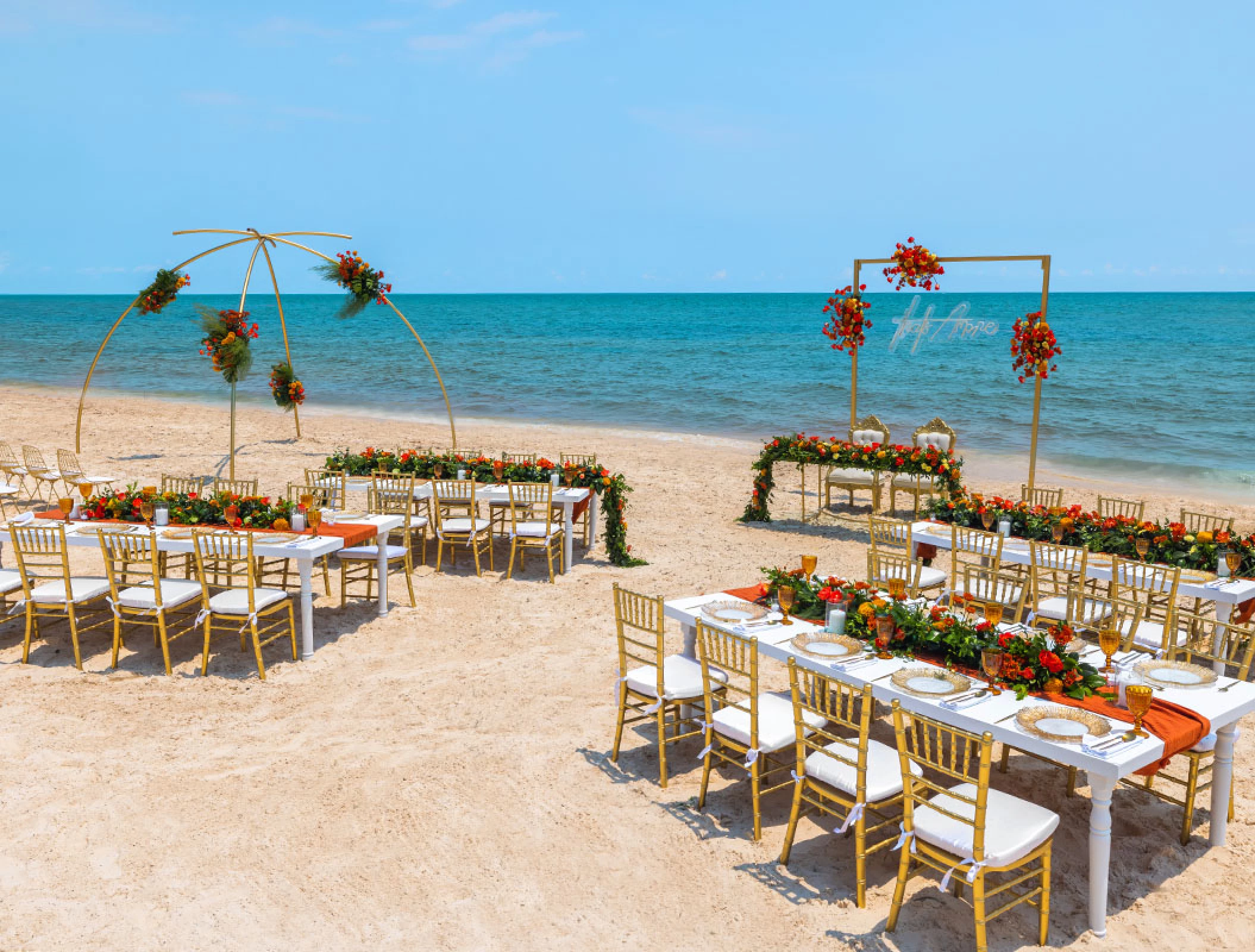 Wedding Ceremony and reception setup at beach venue on Royalton Splash Riviera Cancun