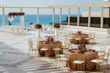 Ceremony and dinner reception decor on the terrace wedding venue at Sandos Cancun
