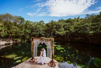 Sandos Caracol Eco Resort cenote wedding venue with couple
