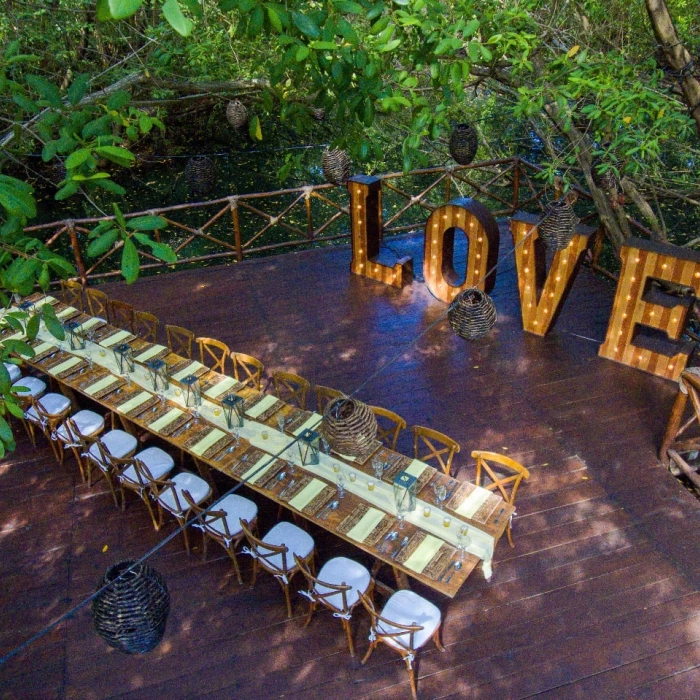 Dinner reception on Mapache Deck wedding venue at Sandos Caracol Eco Resort