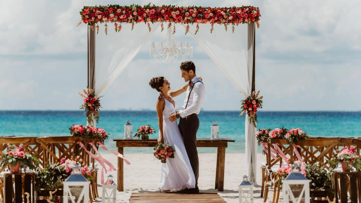 Couple wedding on the beach wedding venue at Sandos Playacar Beach Resort