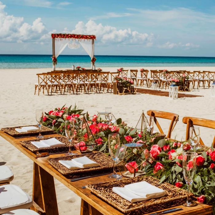 Ceremony and dinner decor on the beach wedding venue at Sandos Playacar Beach Resort