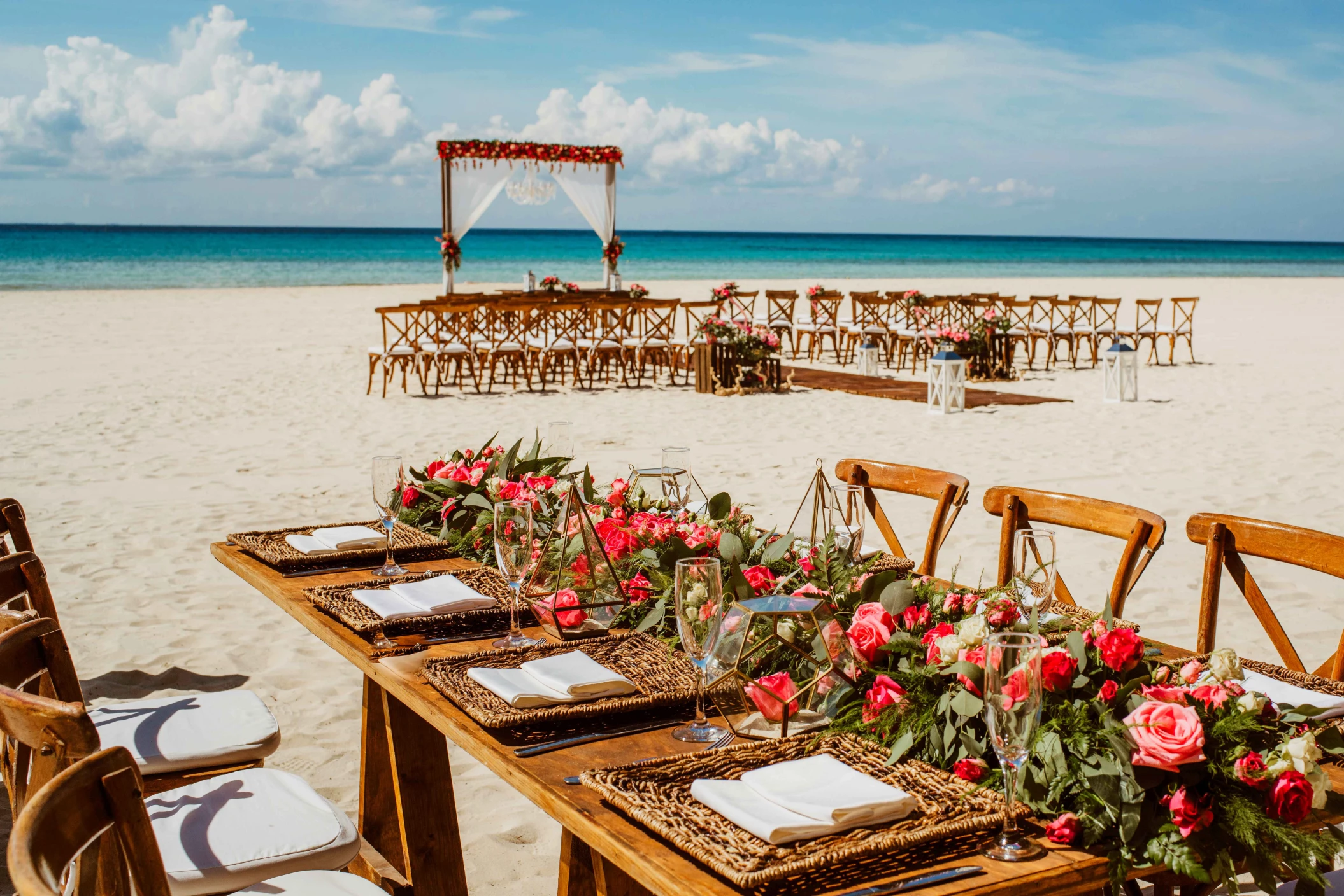 Ceremony and dinner decor on the beach wedding venue at Sandos Playacar Beach Resort