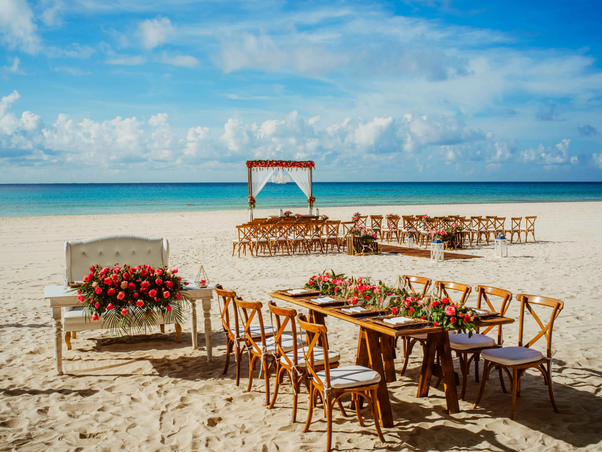 Ceremony and dinner decor on the beach wedding venue at Sandos Playacar Beach Resort