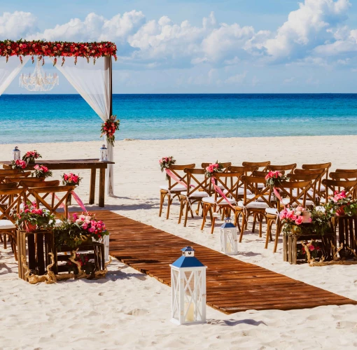 Ceremony and dinner decor on the beach wedding venue at Sandos Playacar Beach Resort