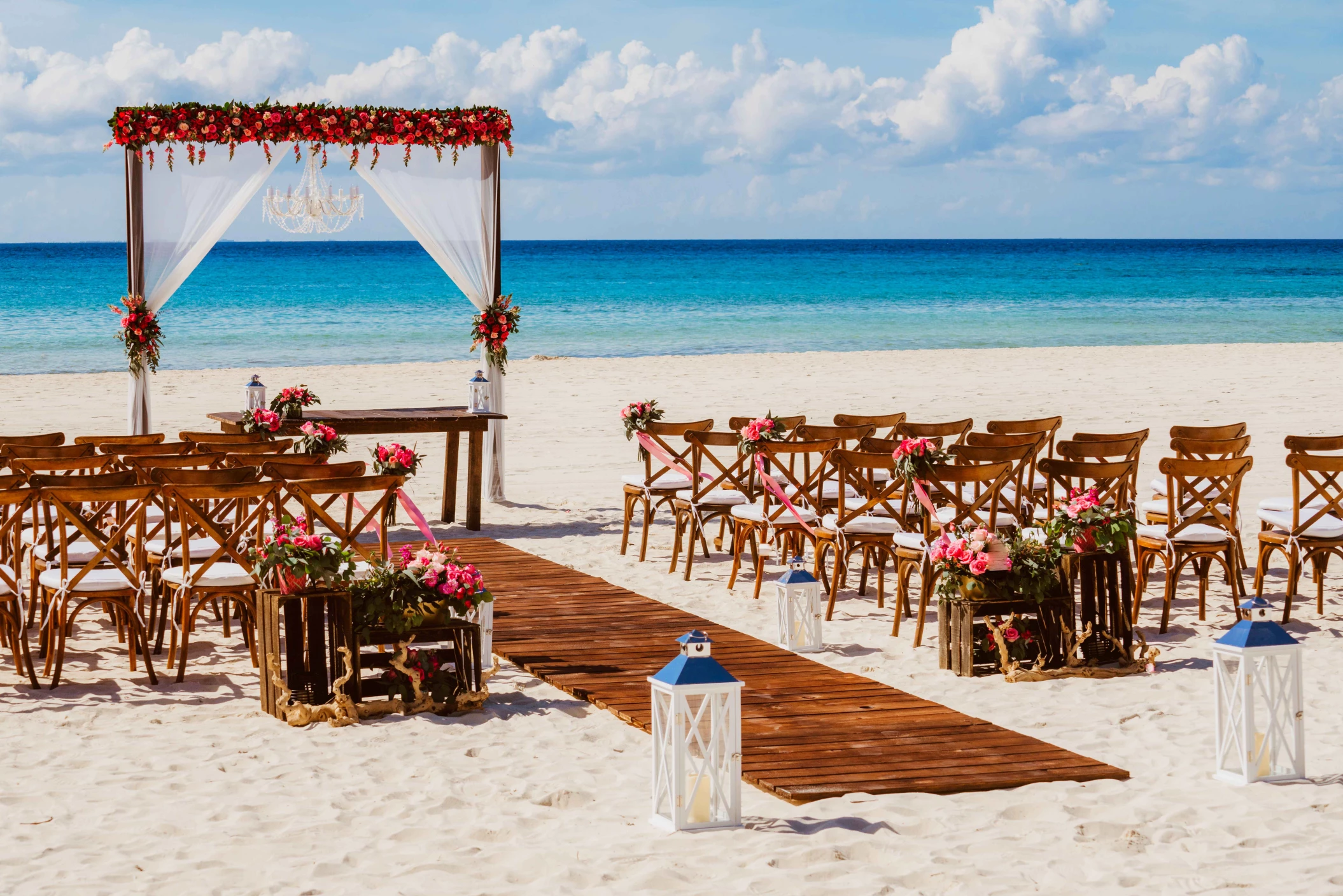 Ceremony and dinner decor on the beach wedding venue at Sandos Playacar Beach Resort