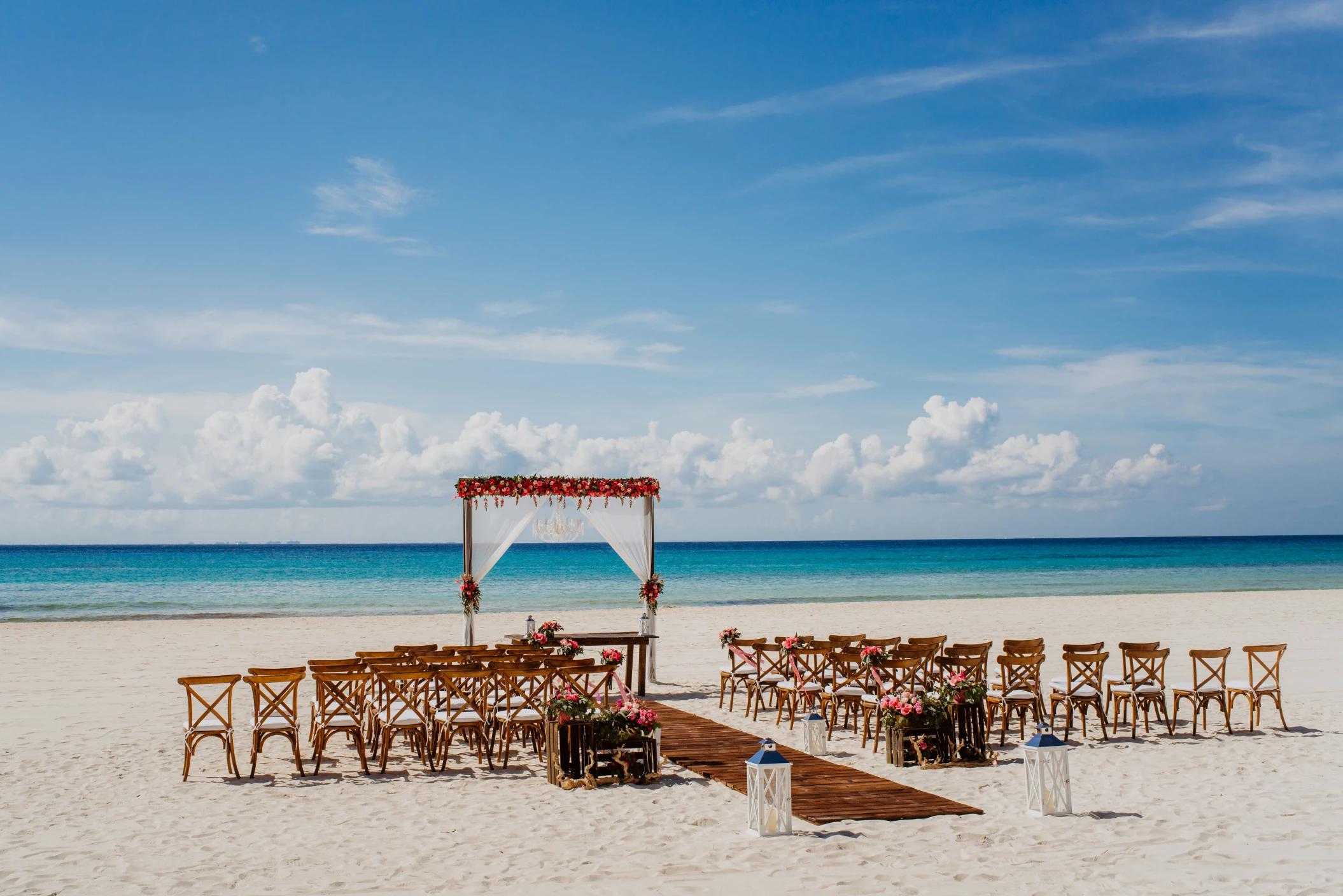 Ceremony and dinner decor on the beach wedding venue at Sandos Playacar Beach Resort