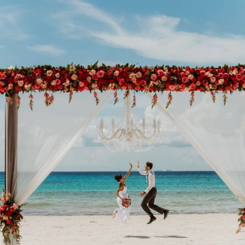 Ceremony and dinner decor on the beach wedding venue at Sandos Playacar Beach Resort