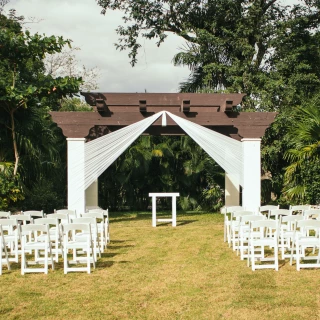 Ceremony decor on the garden wedding venue at Sandos Playacar Beach Resort