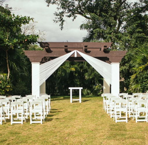 Ceremony decor on the garden wedding venue at Sandos Playacar Beach Resort