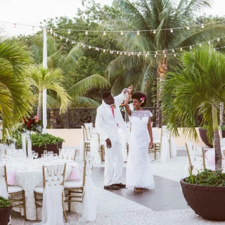 Couple dancing on the terrace wedding venue at Sandos Playacar Beach Resort