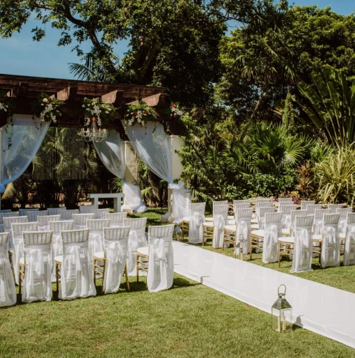 Ceremony decor on the garden wedding venue at Sandos Playacar Beach Resort