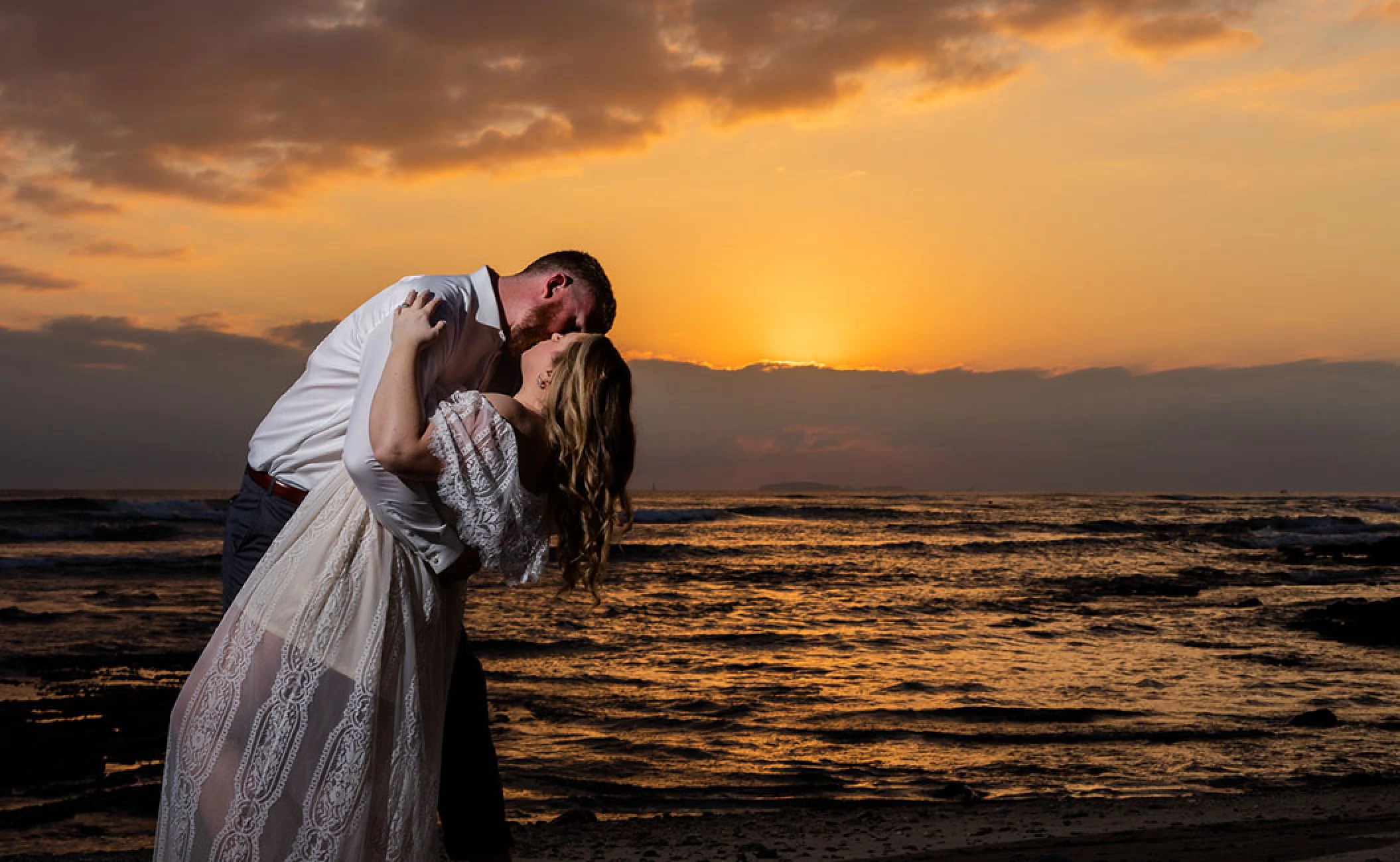 Couple kissing on sunset at Dreams Bahia Mita Surf and Spa