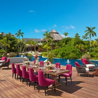 Dinner reception decor on coco cafe deck wedding venue at Secrets Akumal Riviera Maya