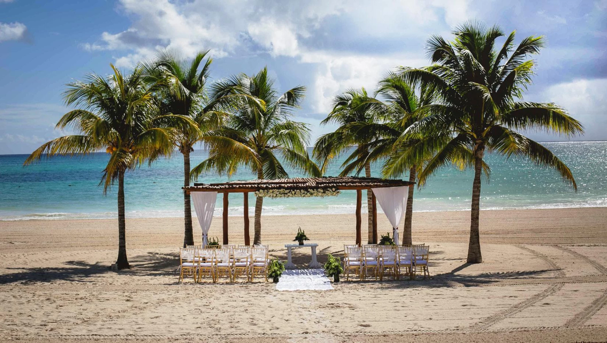 Ceremony decor on the beach wedding venue at Secrets Maroma Beach Riviera Maya