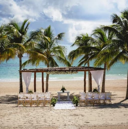 Ceremony decor on the beach wedding venue at Secrets Maroma Beach Riviera Maya