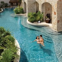 Secrets Maroma Beach Riviera Cancun swim-up room with couple